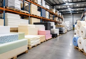 Pallets of wholesale foam sheets stacked in a warehouse