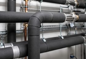 Foam pipe-insulation lagging fitted around copper pipework