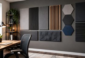 Soundproofing foam panels mounted on an interior wall